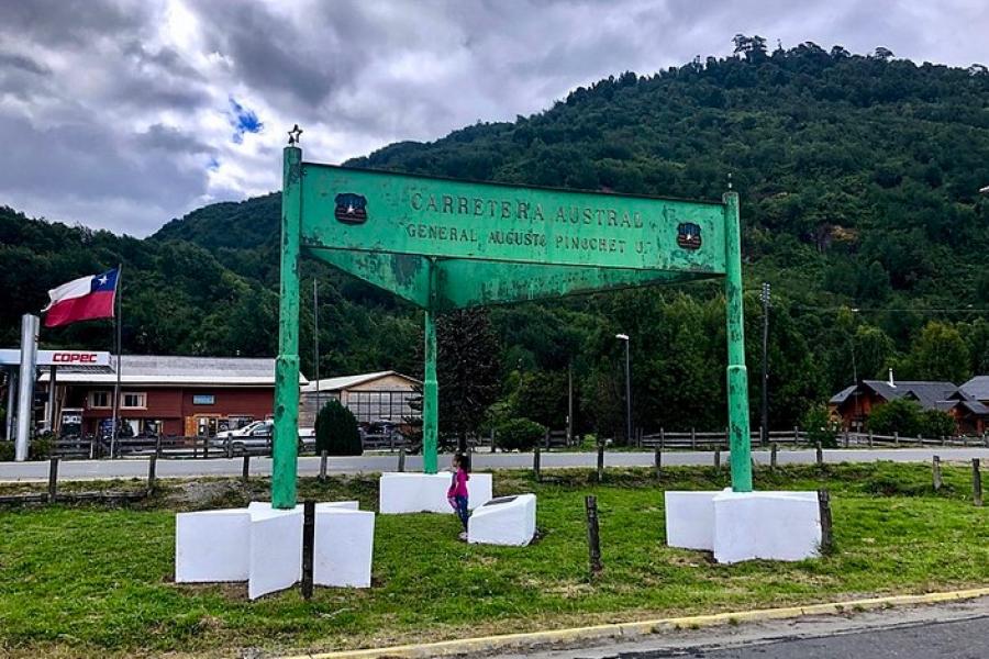 Carretera Austral, Chile - Large green sign structure indicating, "Carretera Austral" with a nod to Augusto Pinochet.